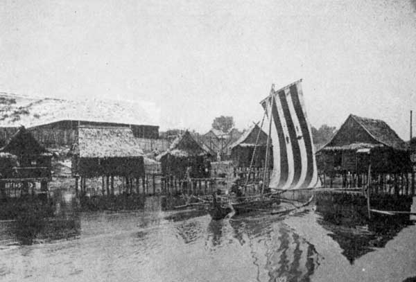 A Sama-Bajau vinta sailing boat with layered sails, photographed in 1923